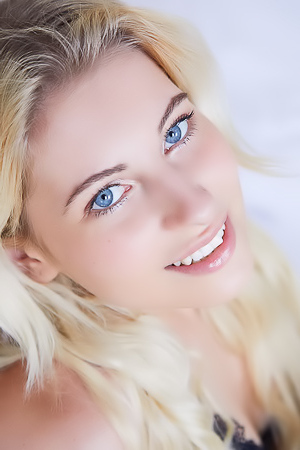 Lilly Bella Caressing Her Lovely Breasts And Tugging Her Panties Aside